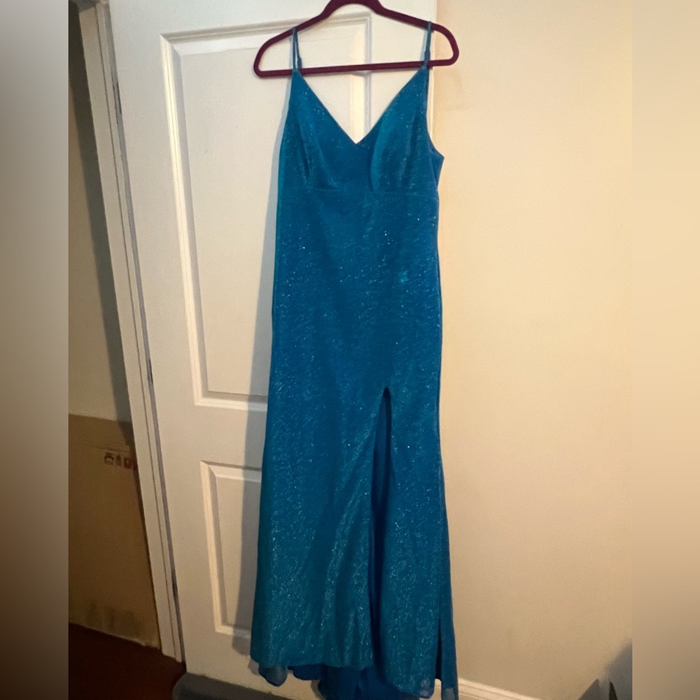 Long open back spaghetti strap light blue glittery homecoming dress